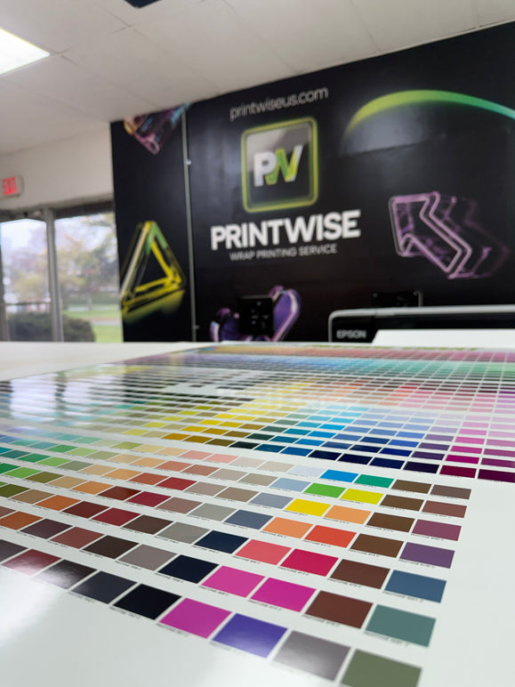 Printwise showroom with a large printed wall graphic and a floor-length color swatch display