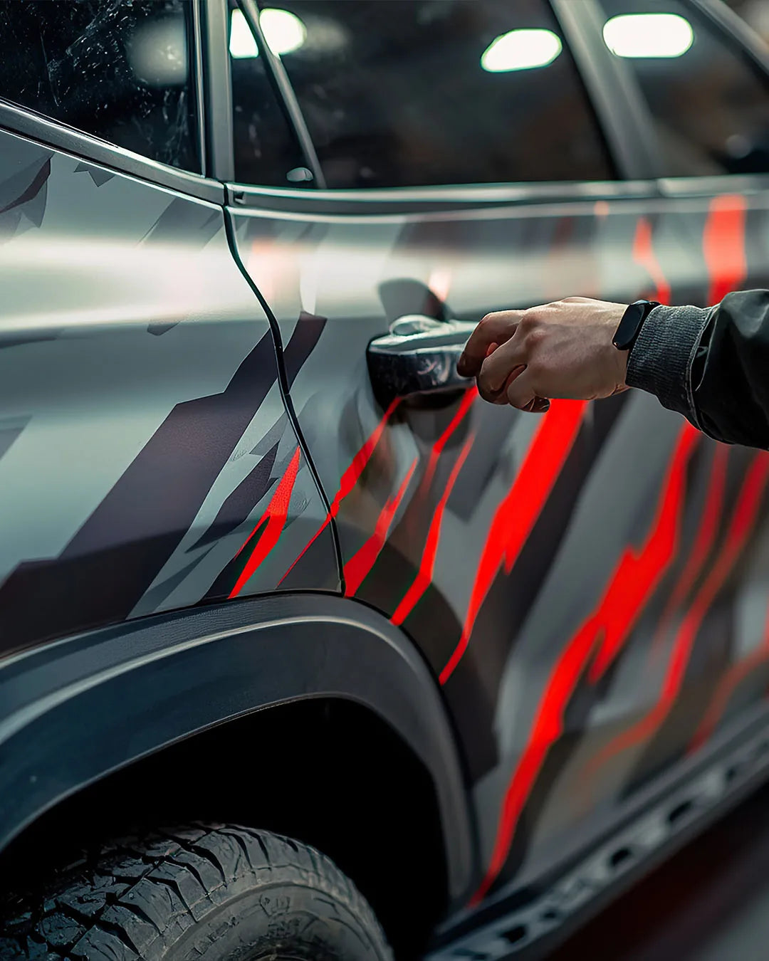 iWrap NY installer applying printed vinyl to a vehicle